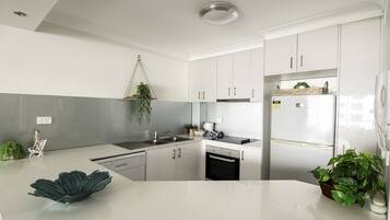 Apartment, 2 Bedrooms | Private kitchen | Fridge, microwave, oven, stovetop