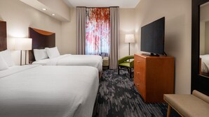 A hotel room with two beds, a desk, a television, and a chair. - Fairfield Inn & Suites Visalia Tulare (Tulare)
