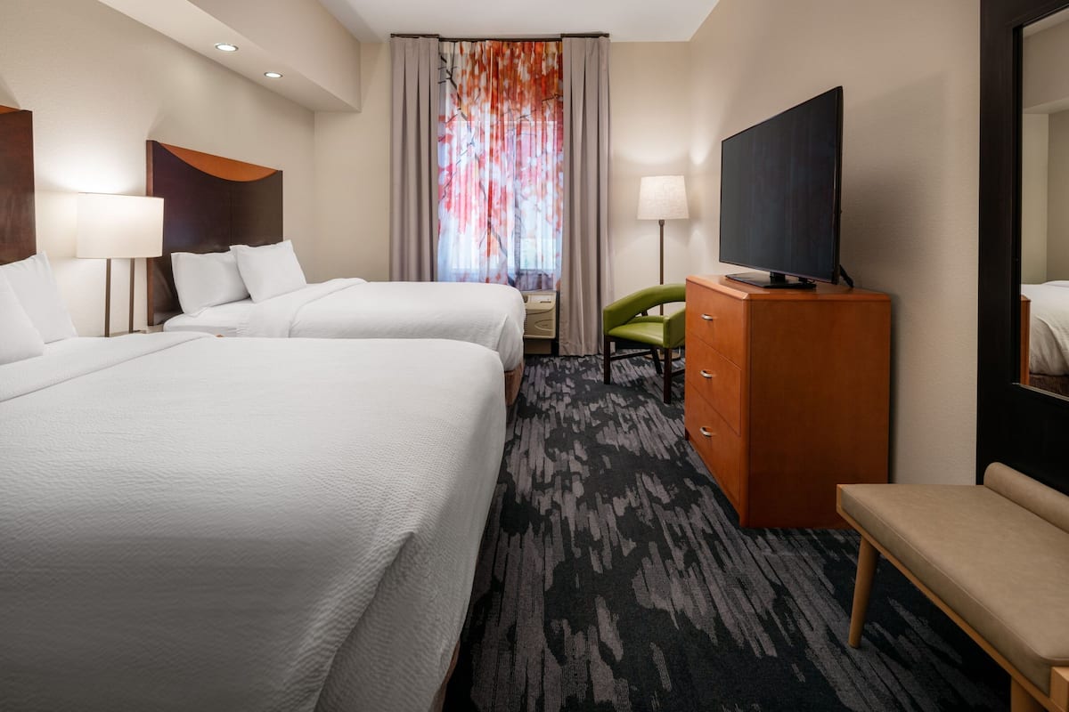 Pillow-top beds, desk, blackout curtains, iron/ironing board