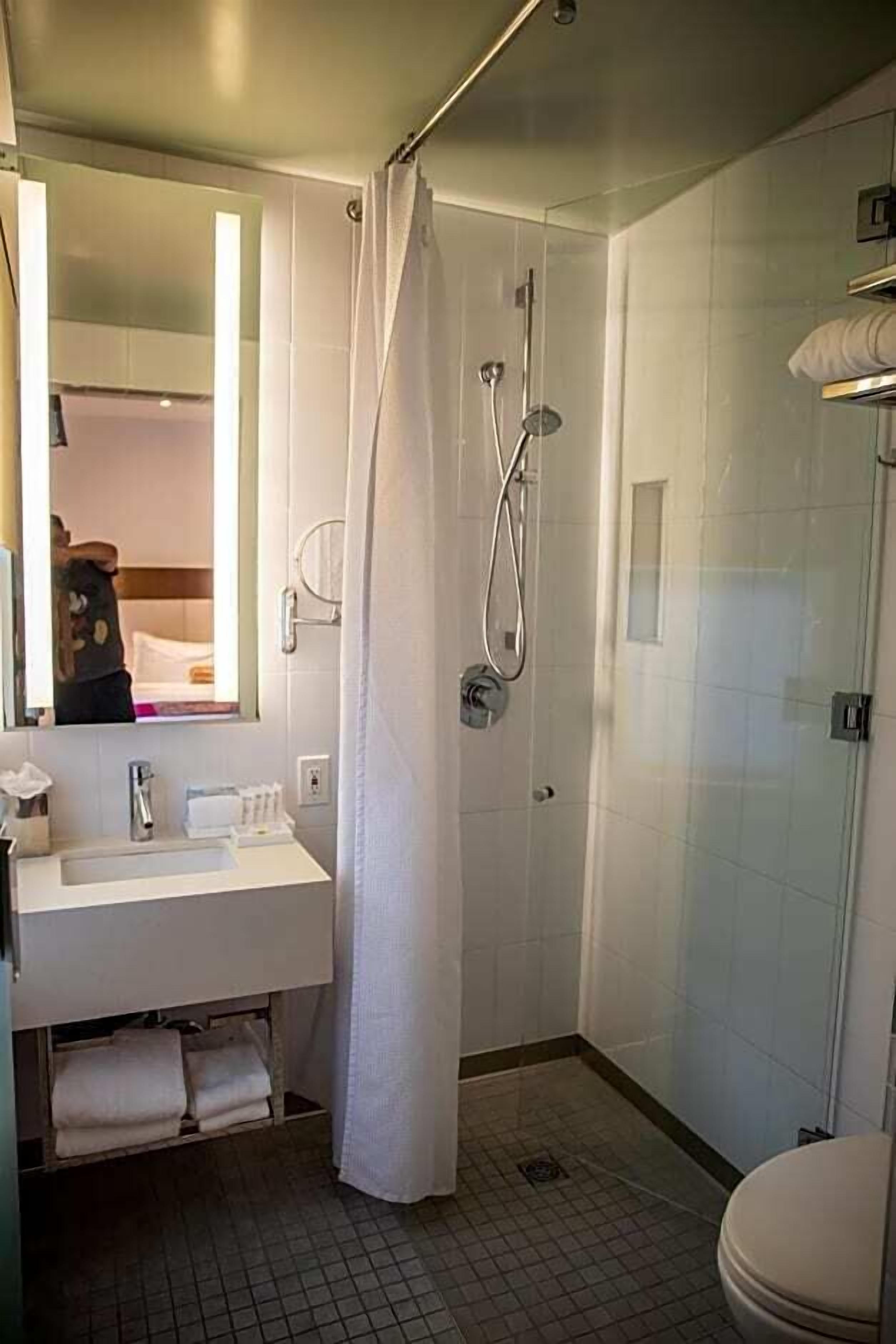 Bathroom | Shower, designer toiletries, hair dryer, bathrobes