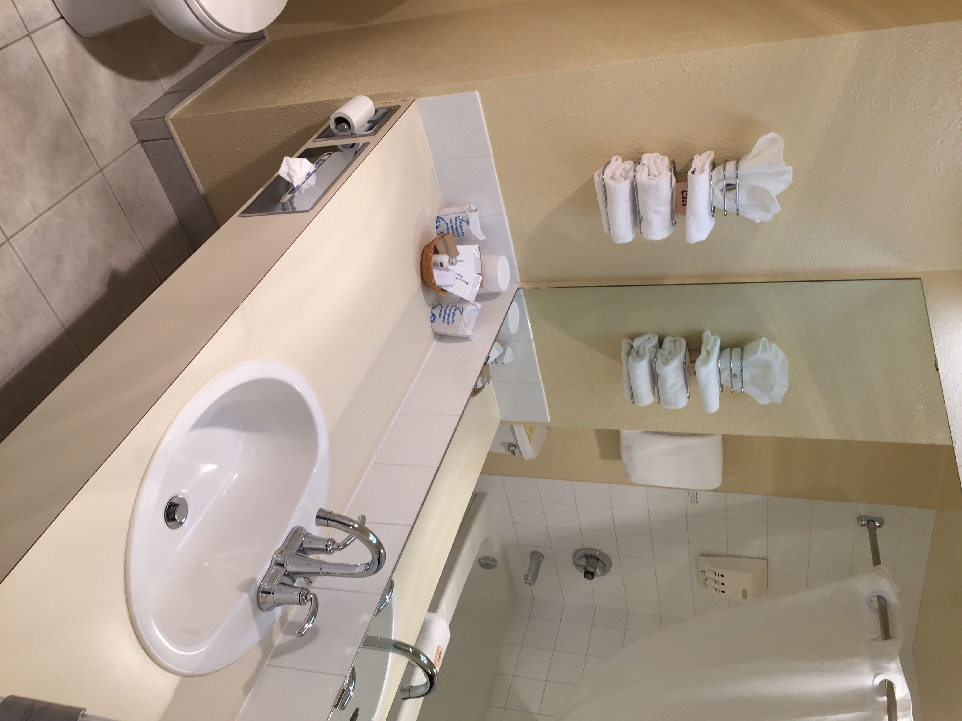 signature room, 2 queen beds | bathroom | combined shower/bathtub, free toiletries, hair dryer, towels