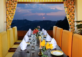 Breakfast, lunch, dinner served; Indian cuisine, garden views 