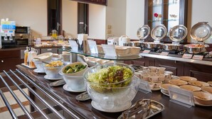 A buffet setup with various food items and a coffee station. - GRG Hotel Naha (Naha)