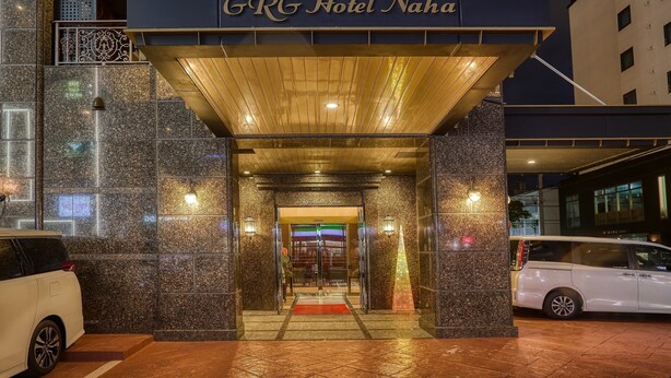 The exterior of GRG Hotel Naha with a prominent entrance, a covered walkway, and a modern design. - GRG Hotel Naha (Naha)