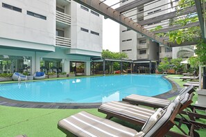 Outdoor pool, open 6:00 AM to 9:00 PM, sun loungers