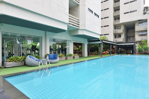 Outdoor pool, open 6:00 AM to 9:00 PM, sun loungers