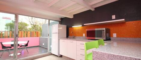 Full-size fridge, microwave, espresso maker, cookware/dishes/utensils