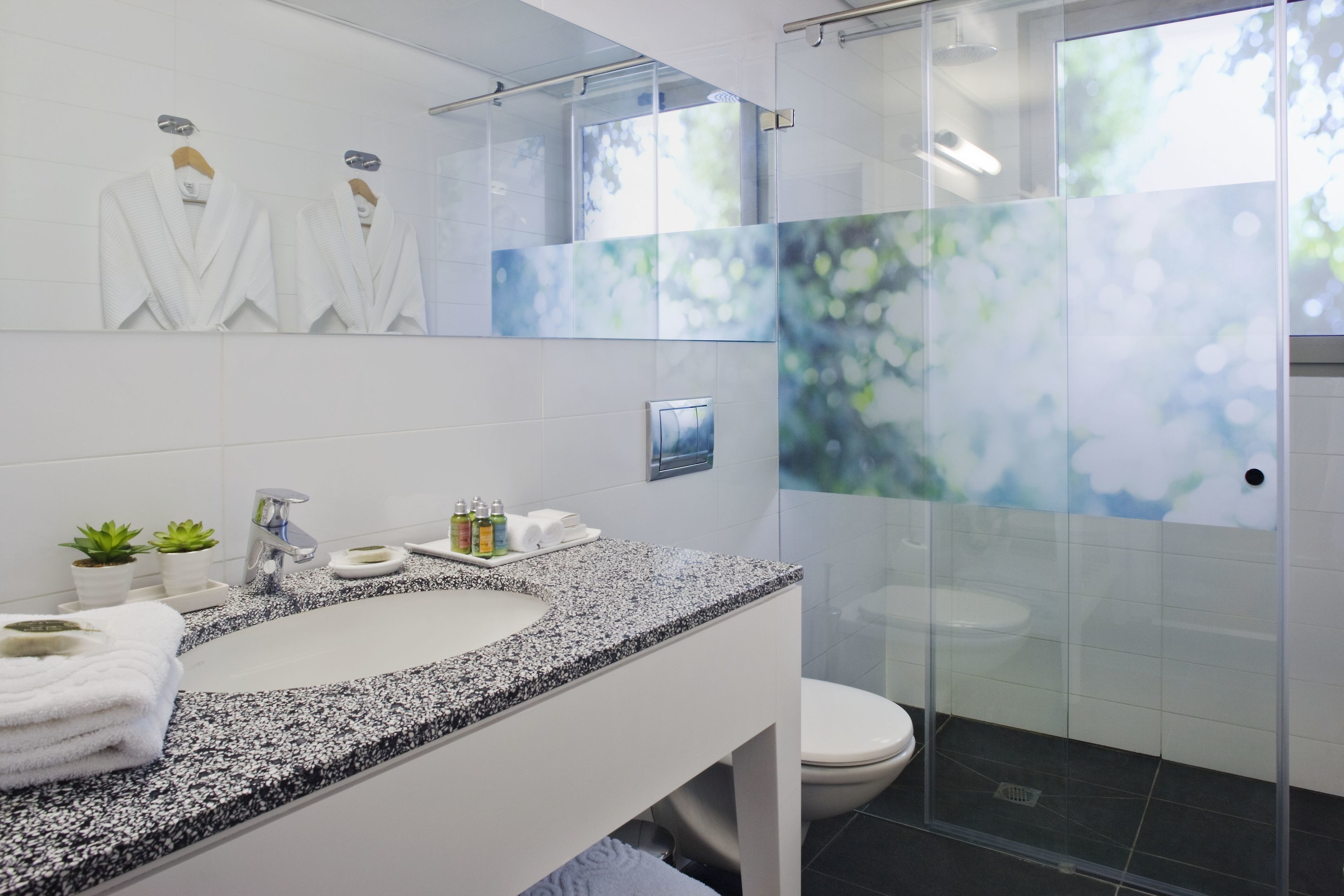 rainfall showerhead, designer toiletries, hair dryer, bathrobes