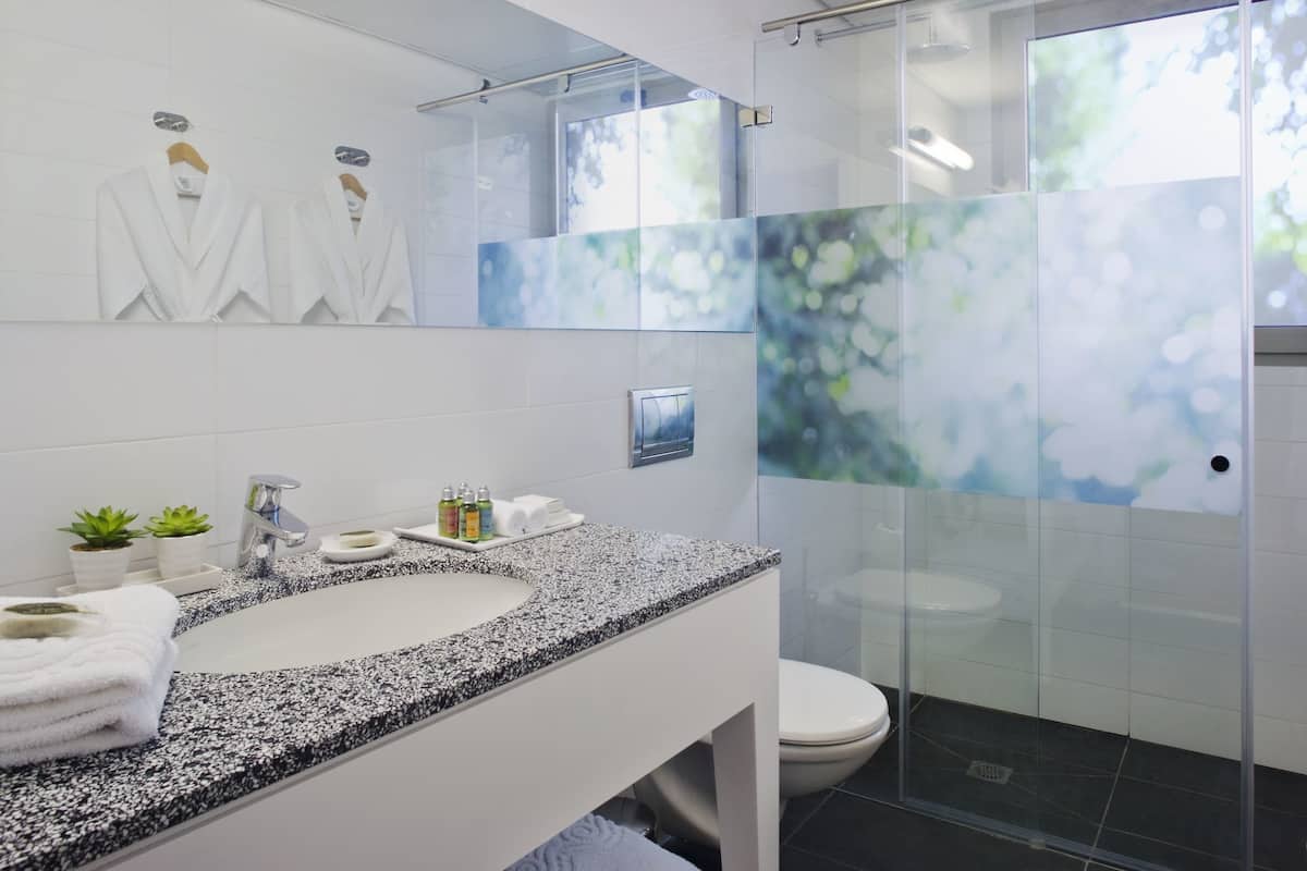 rainfall showerhead, designer toiletries, hair dryer, bathrobes