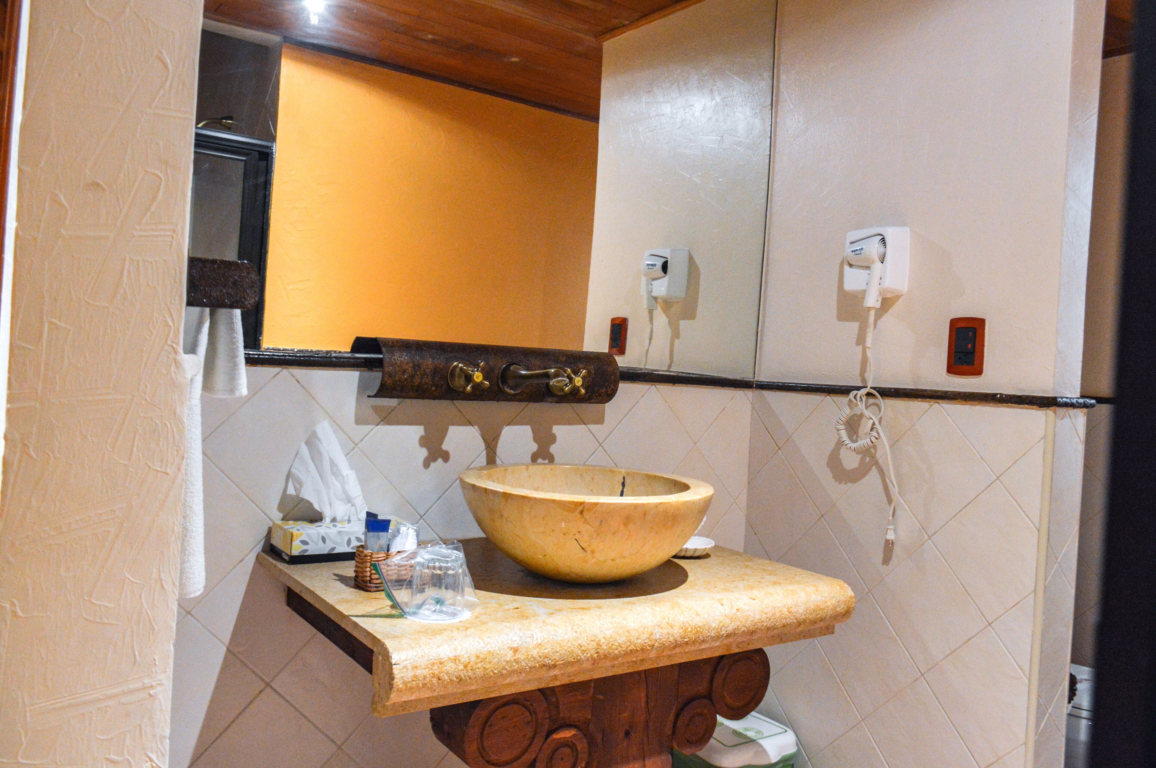 premium house, multiple beds | bathroom sink