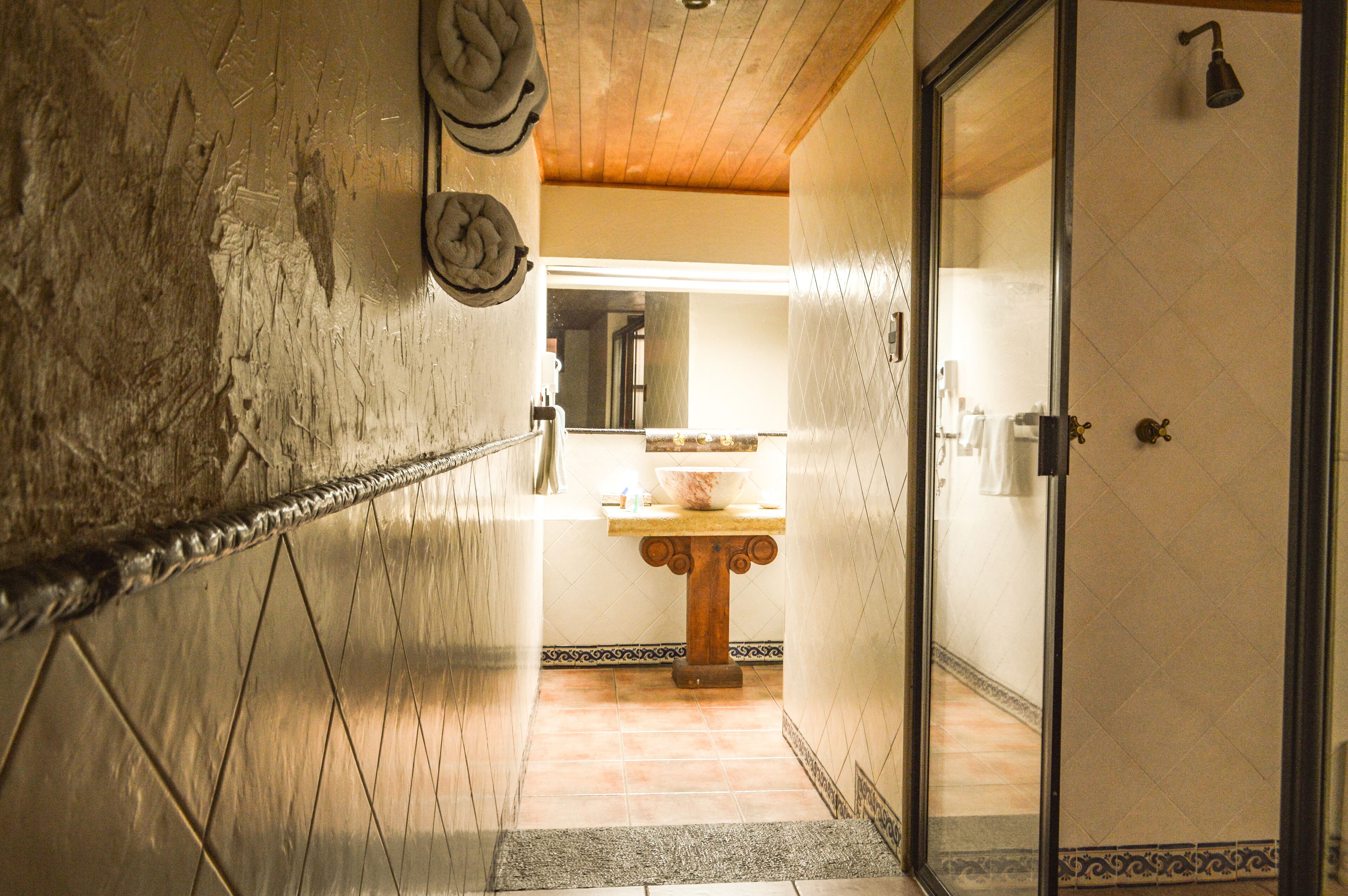 shower, designer toiletries, hair dryer, towels