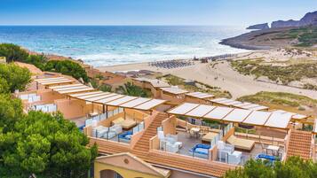 On the beach, sun loungers, beach umbrellas, scuba diving