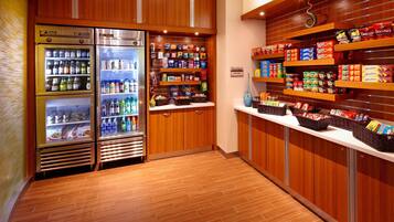 A snack bar with refrigerated drinks, snacks, and packaged foods.