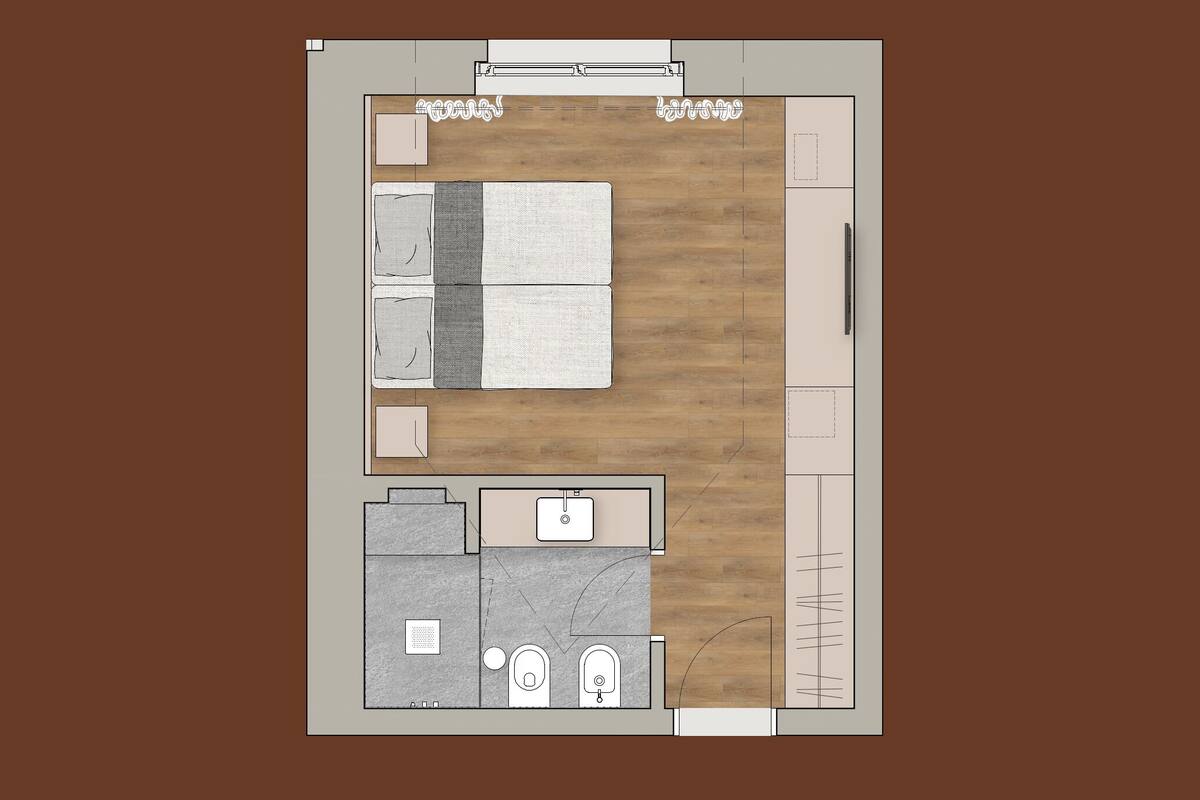 Vista cenital de una habitación de hotel con cama, una pequeña zona de estar, baño y kitchenette.