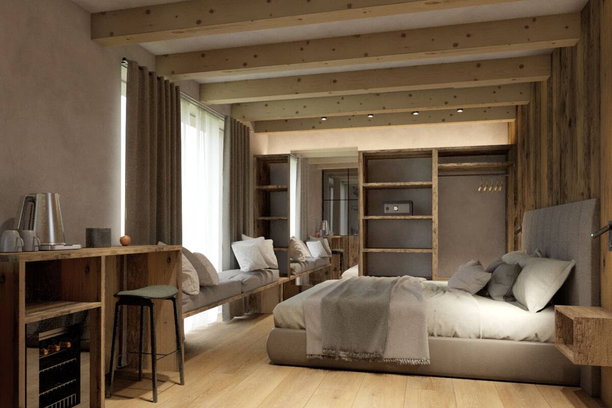 Un dormitorio acogedor con cama, escritorio y armario empotrado.