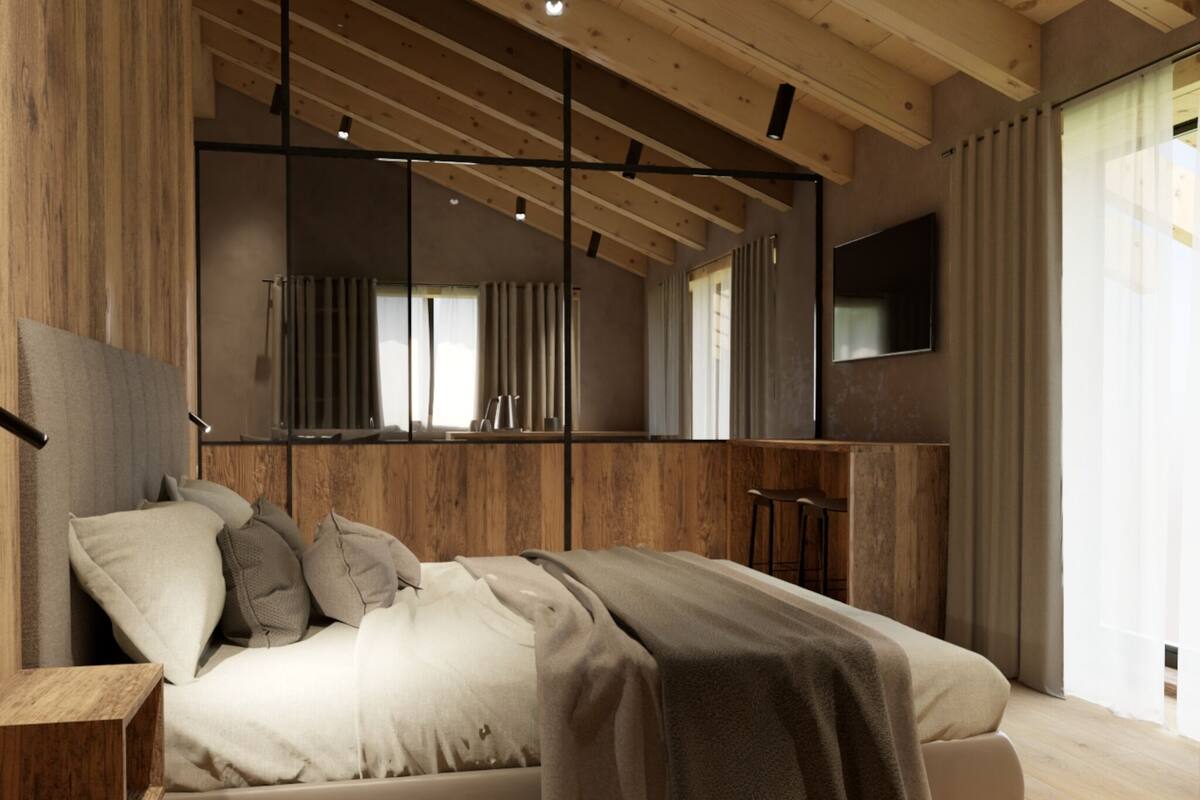 Un dormitorio moderno con una cama grande, vigas de madera, un televisor y un ventanal amplio.