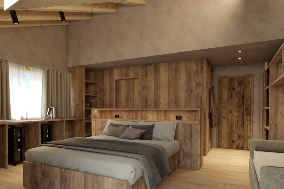 Un dormitorio moderno con una cama grande, cabecera de madera, estanterías integradas y un ambiente acogedor.