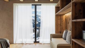Superior Triple Room | Living area | 26-inch TV with satellite channels