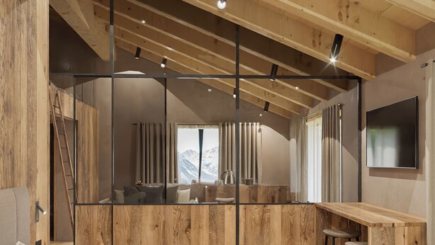 A modern bedroom with a wooden ceiling, a large mirror, a bed, a desk, and a TV. - Al Nin Hotel&Spa (Livigno)