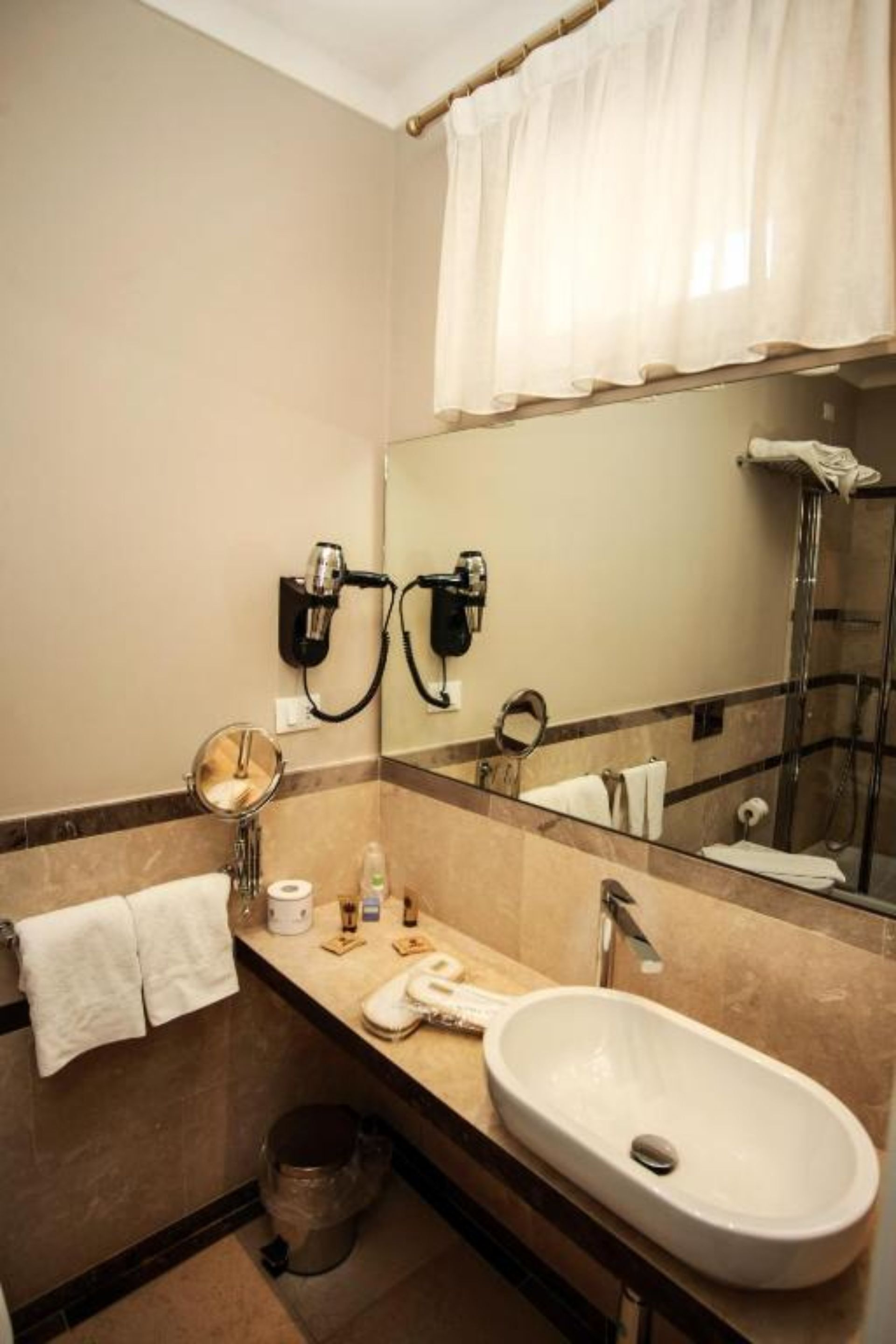 superior room, city view | bathroom | shower, rainfall showerhead, designer toiletries, hair dryer