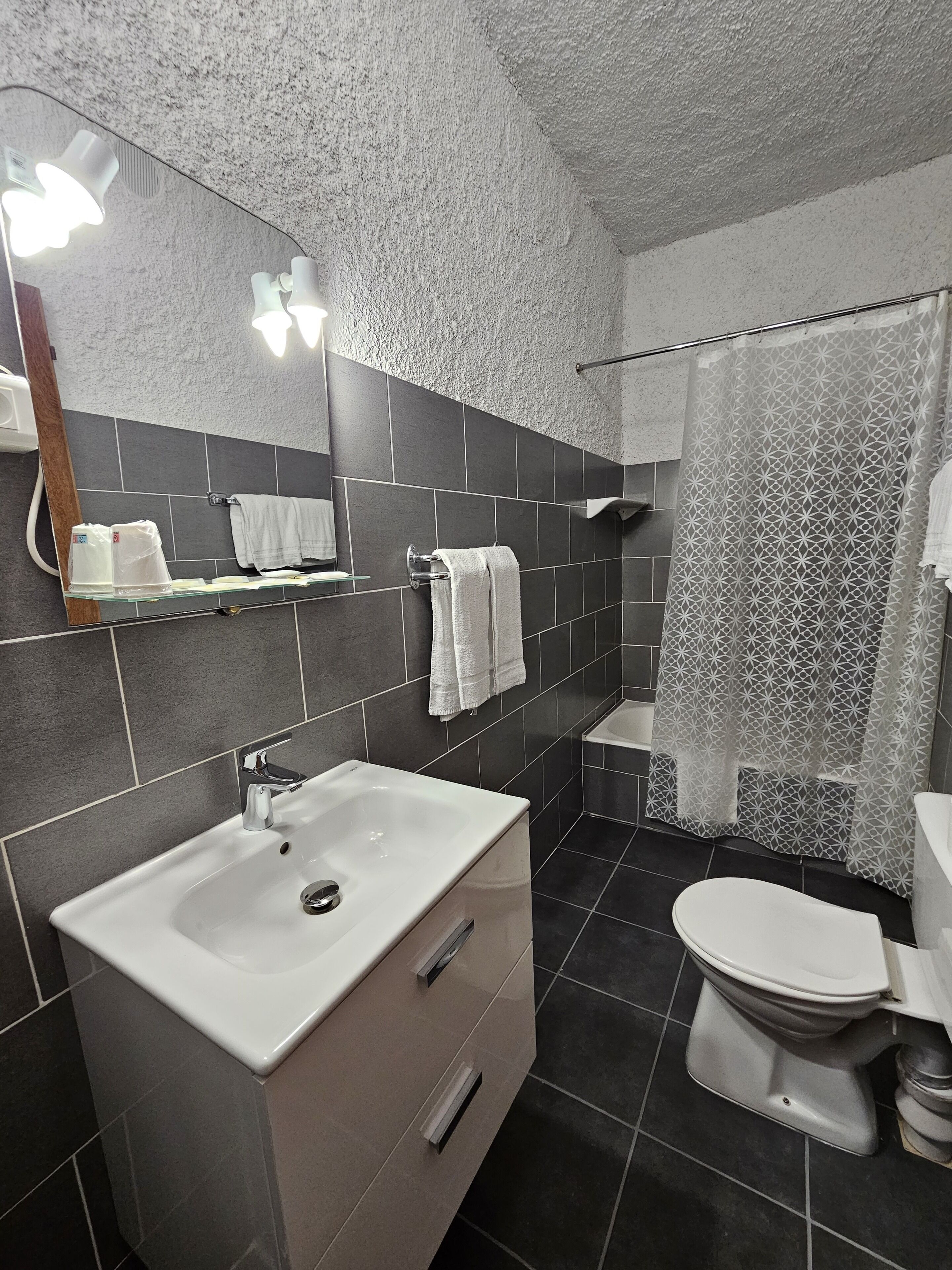 panoramic double room, sea view | bathroom | hair dryer, towels