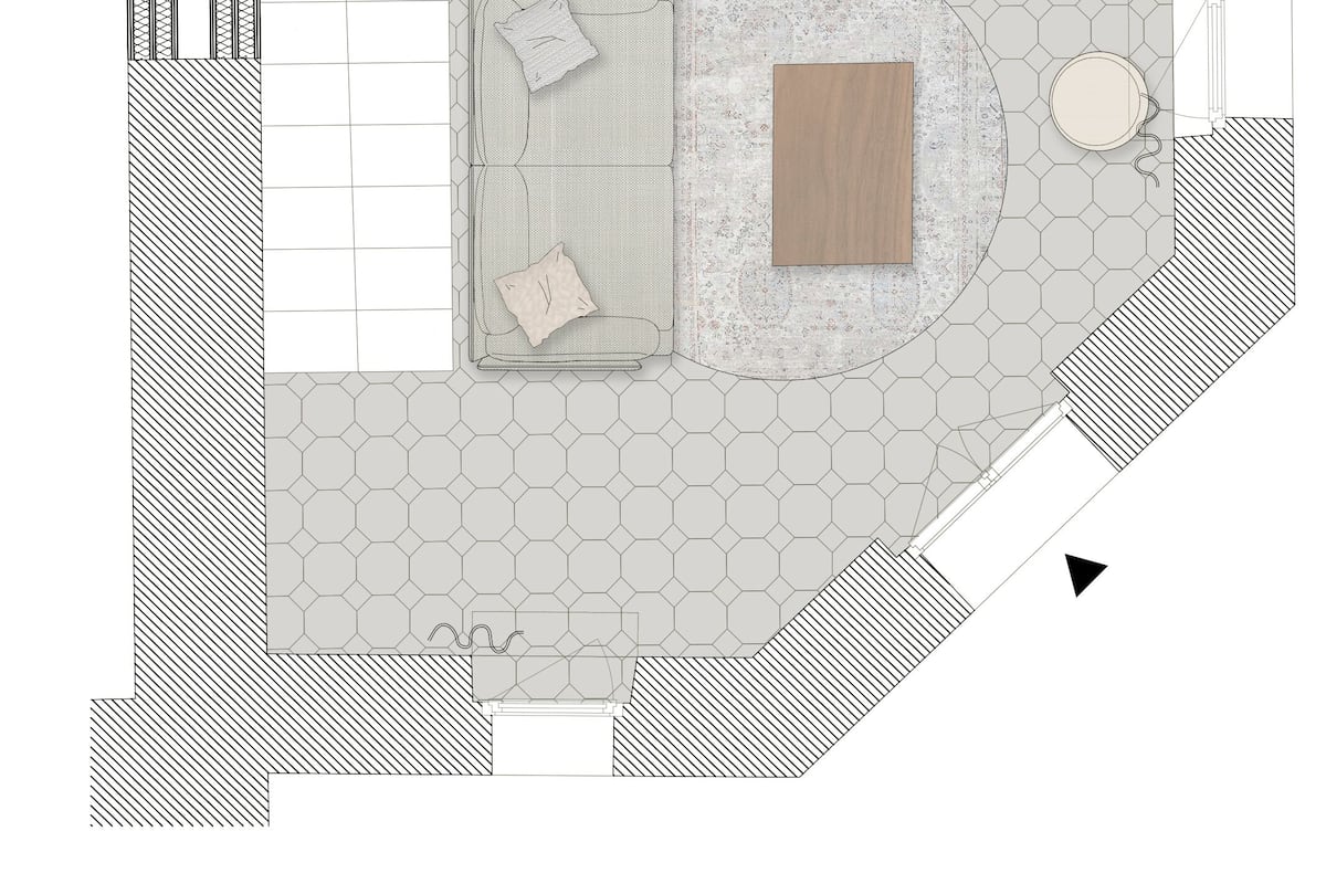 A top-down floor plan of a hotel lobby with a central seating area, a wooden accent wall, and hexagonal patterned flooring.