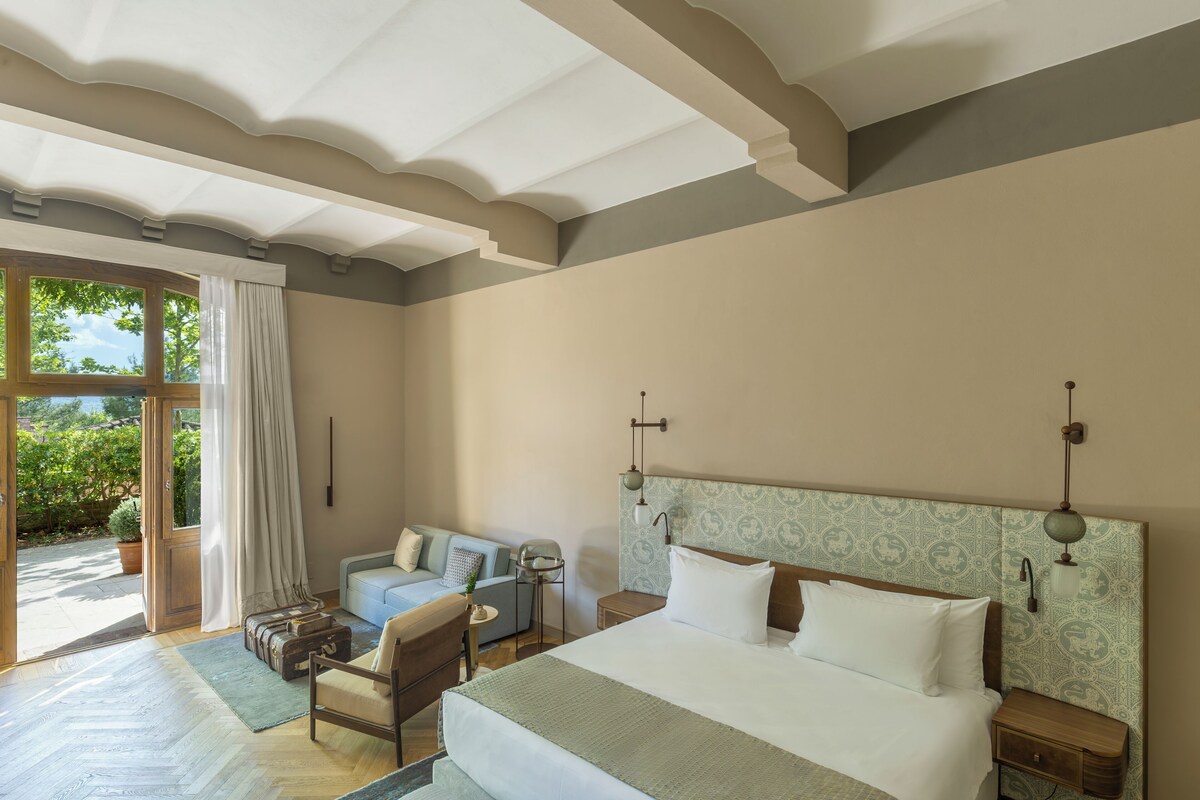 Junio Suite with Patio | Premium bedding, down comforters, minibar, in-room safe