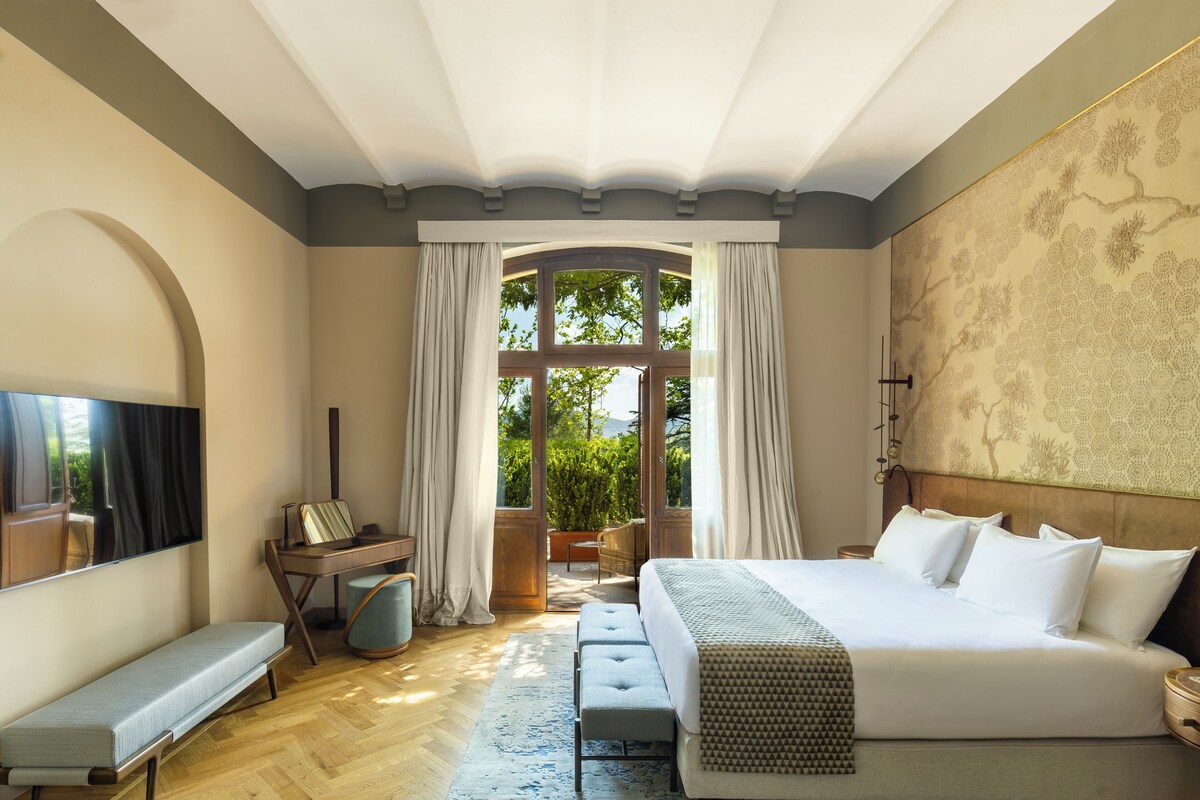 Deluxe Suite with Patio | Premium bedding, down comforters, minibar, in-room safe