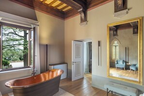 Signature Suite | Bathroom | Designer toiletries, hair dryer, bathrobes, slippers