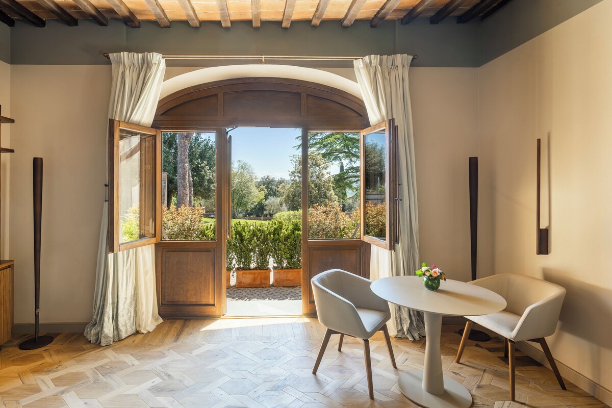 Suite with Patio | Premium bedding, down comforters, minibar, in-room safe