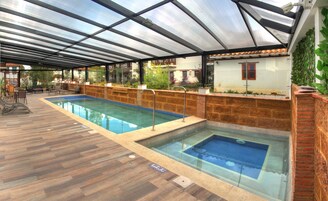 Indoor pool, open 10 AM to 8 PM, pool umbrellas, sun loungers