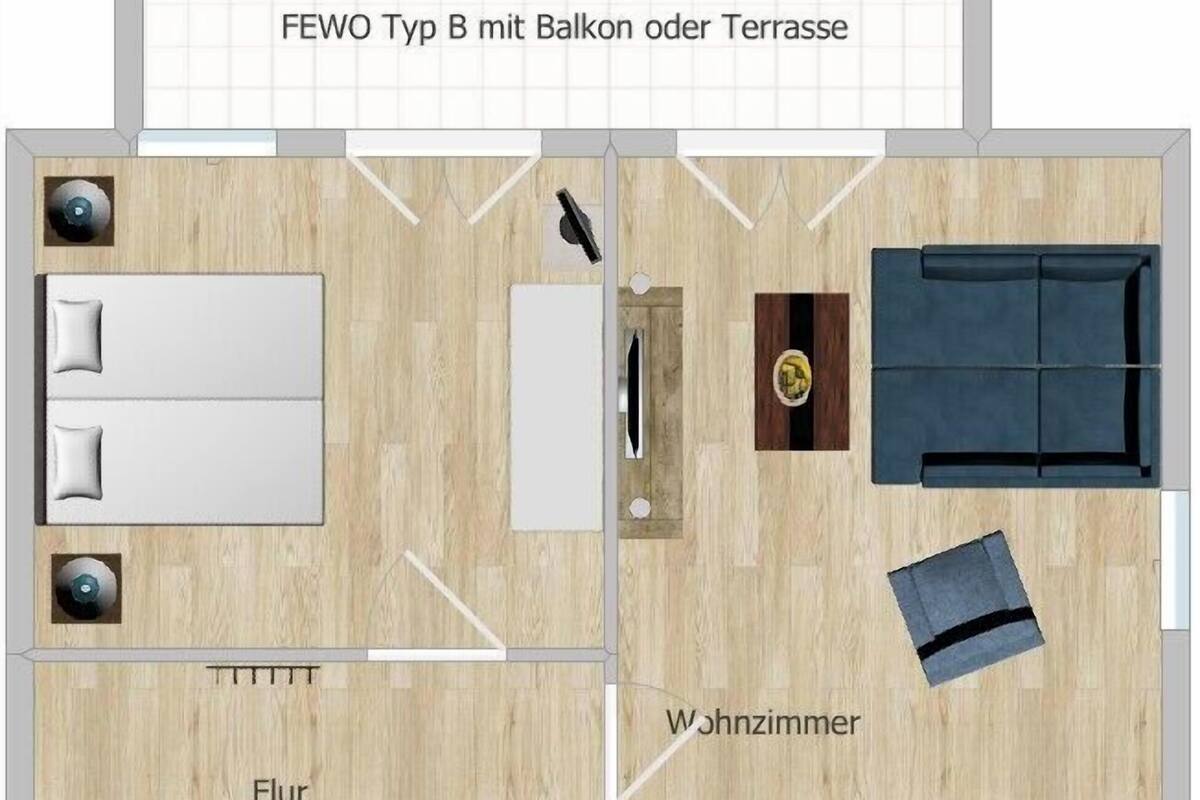 Ein Grundriss einer Zwei-Zimmer-Wohnung mit Balkon oder Terrasse, einem Wohnzimmer, einer Essecke und einer Küche.