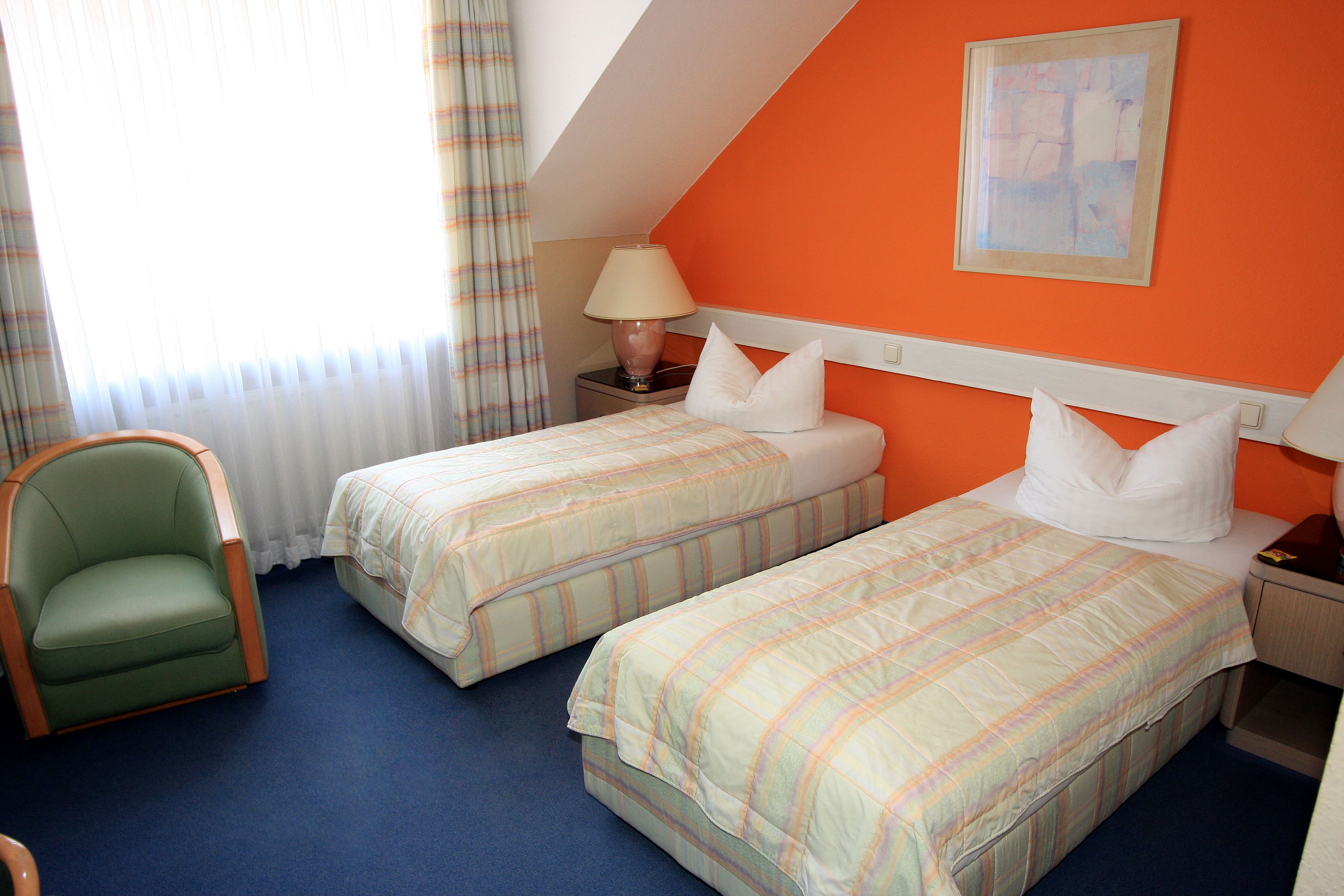twin room | premium bedding, select comfort beds, individually furnished, desk