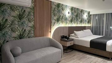 Deluxe Room | Premium bedding, minibar, in-room safe, individually decorated