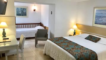 Quarto standard | Frigobar, cortinas blackout, Wi-Fi de cortesia, roupa de cama