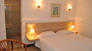 Quarto standard | Frigobar, cortinas blackout, Wi-Fi de cortesia, roupa de cama