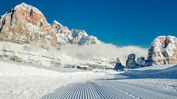 A snow-covered mountain landscape with a clear sky.