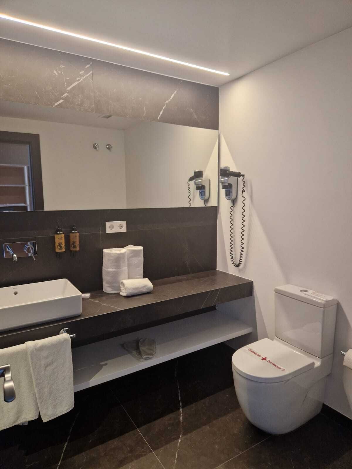 superior double room | bathroom | shower, hair dryer, towels