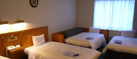 Family Quadruple Room, 4 Bedrooms, Non Smoking | Down comforters, desk, laptop workspace, blackout drapes