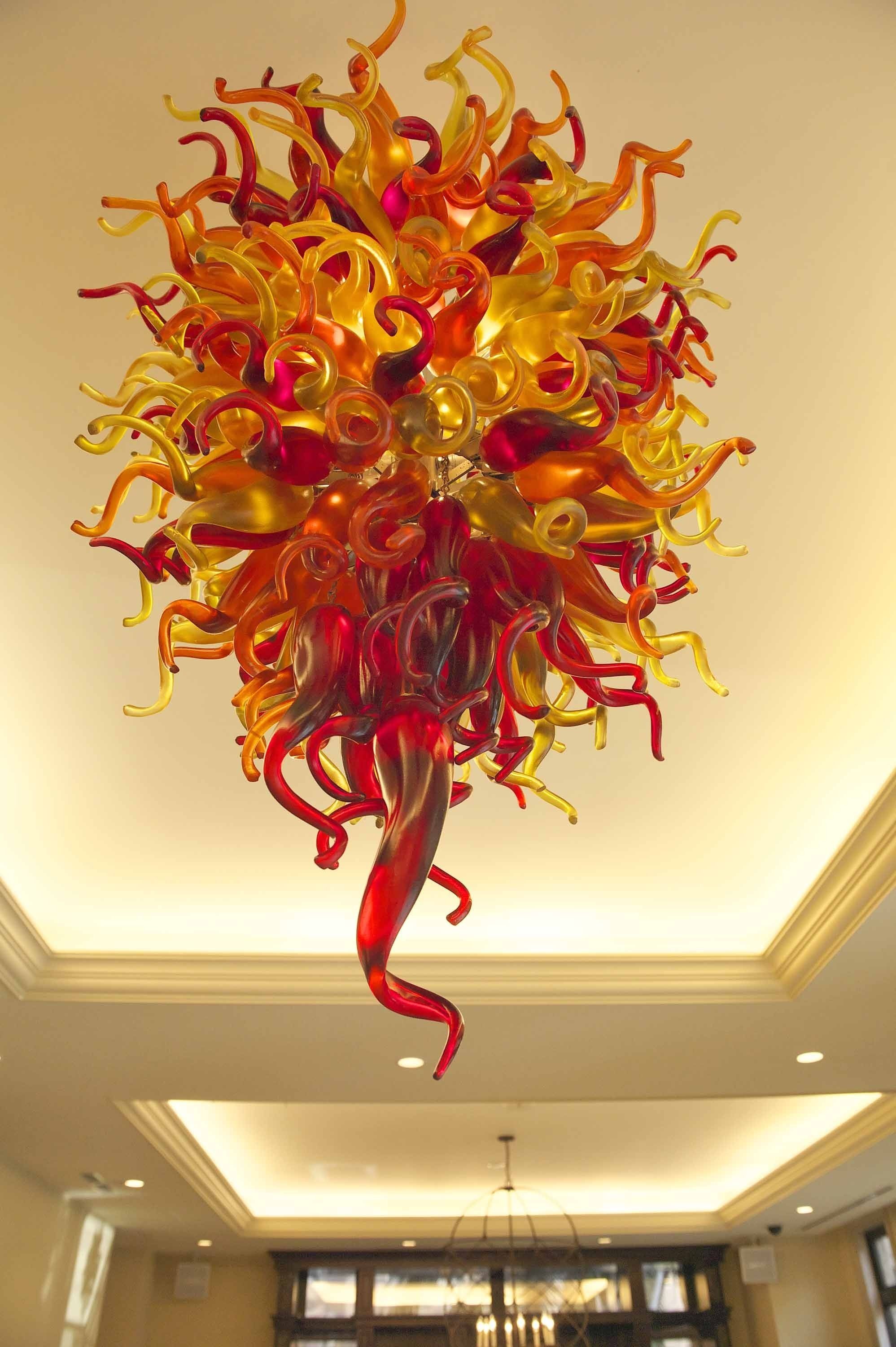 A chandelier with a complex, abstract design featuring multiple colors and shapes.