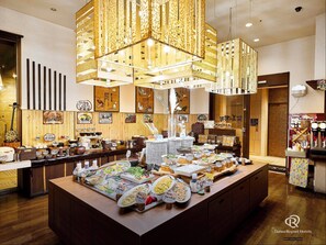 A buffet area with various dishes and a traditional Japanese interior. - Daiwa Roynet Hotel Naha - Kokusaidori (Naha)