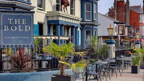 A building with a sign reading 'THE BOLD BAR-DINING-HOTEL' and a horse statue on the facade. - The Bold Hotel, BW Signature Collection (Southport)