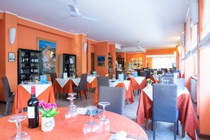 Breakfast, lunch served; international cuisine, al fresco dining 