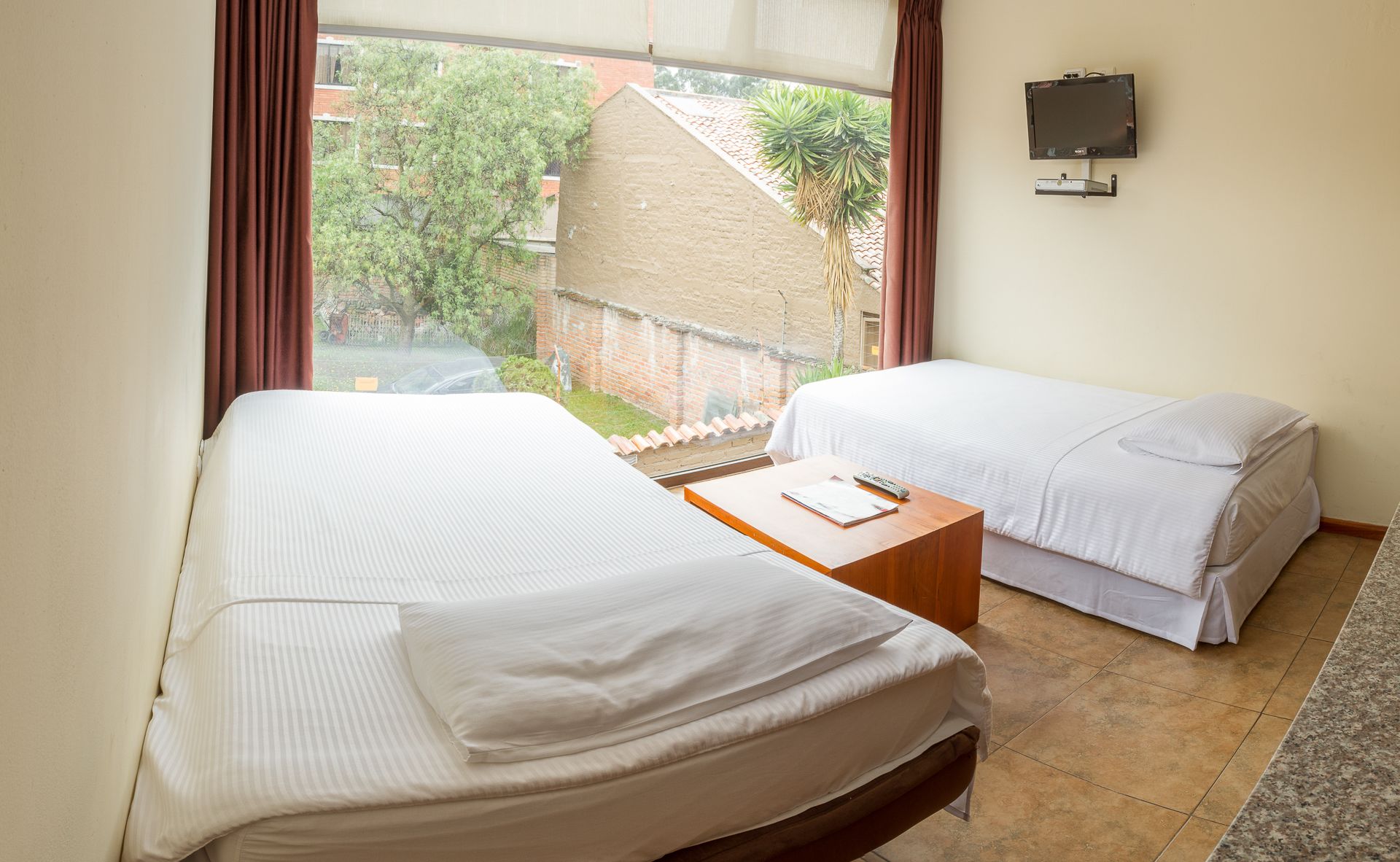 premium studio suite, 1 bedroom, refrigerator & microwave, courtyard area | in-room safe, individually decorated, desk, iron/ironing board