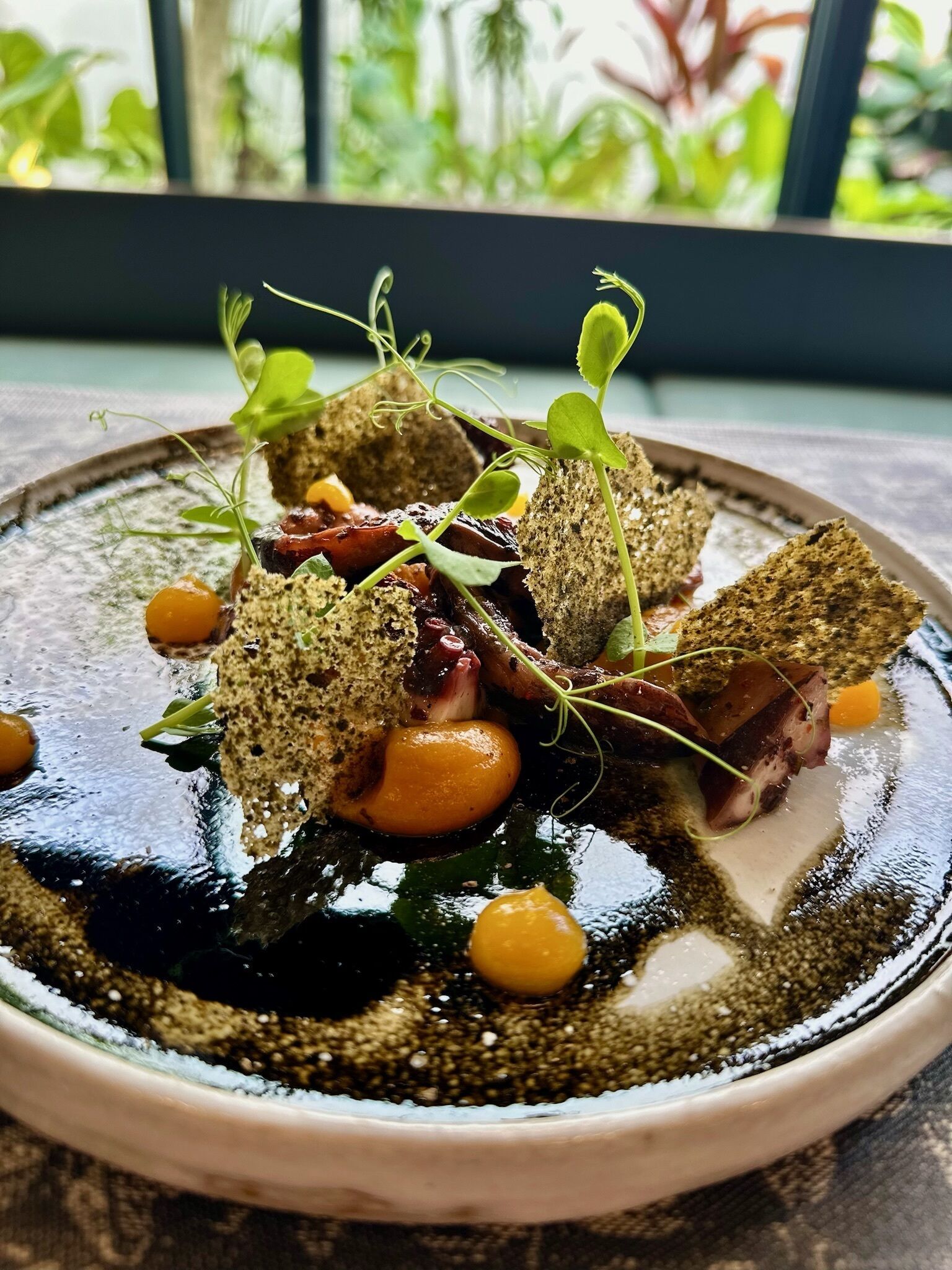 A dish with various ingredients on a plate.