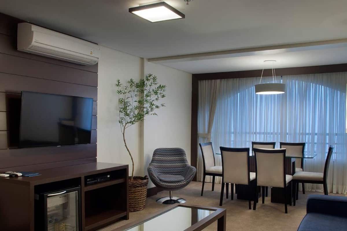 Premier Room | Living area | 50-inch LCD TV with cable channels, TV