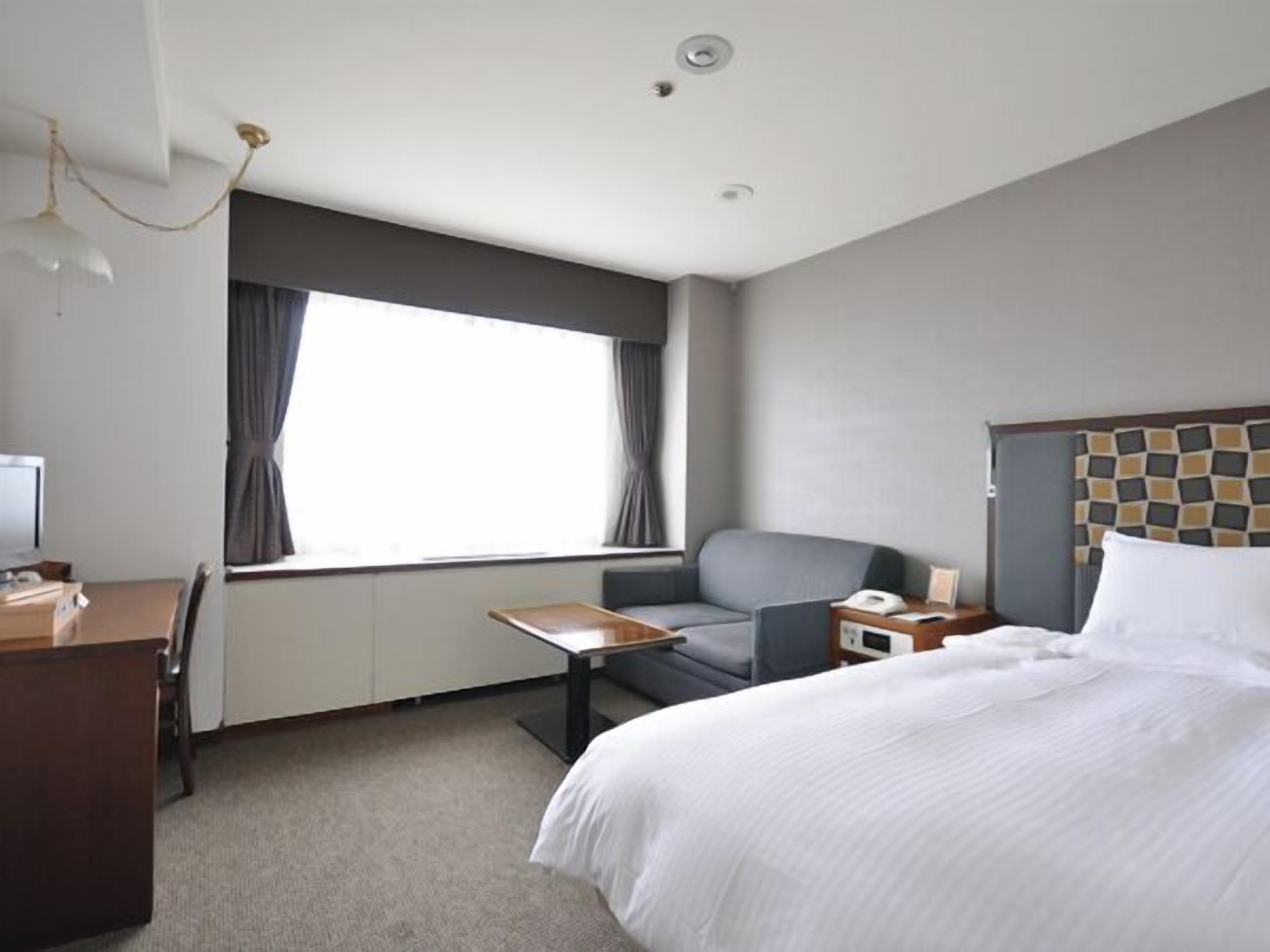 Desk, laptop workspace, blackout curtains, iron/ironing board