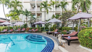 Outdoor pool, pool umbrellas, sun loungers