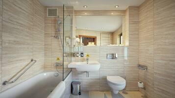 A modern bathroom with a bathtub, sink, and toilet, featuring a glass shower enclosure and a mirror.