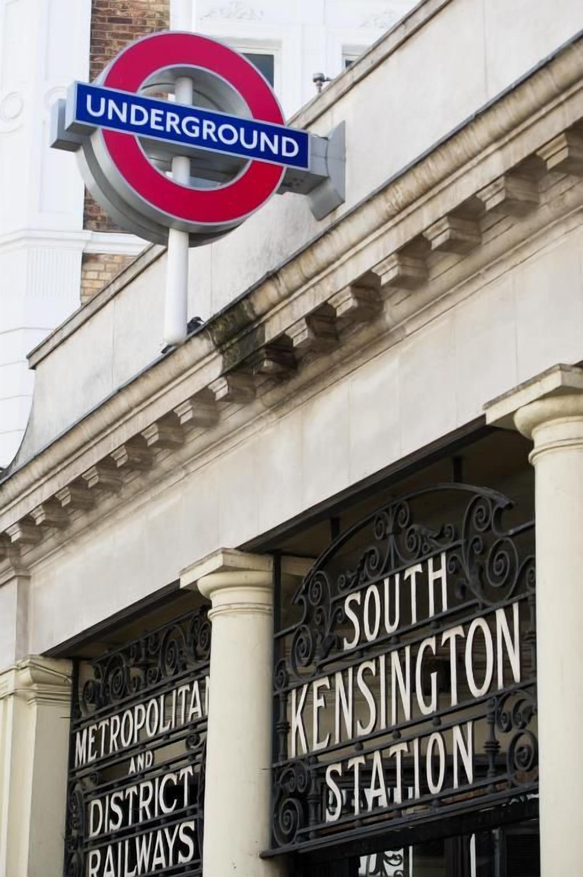 A sign for the Underground station and the South Kensington Station entrance.